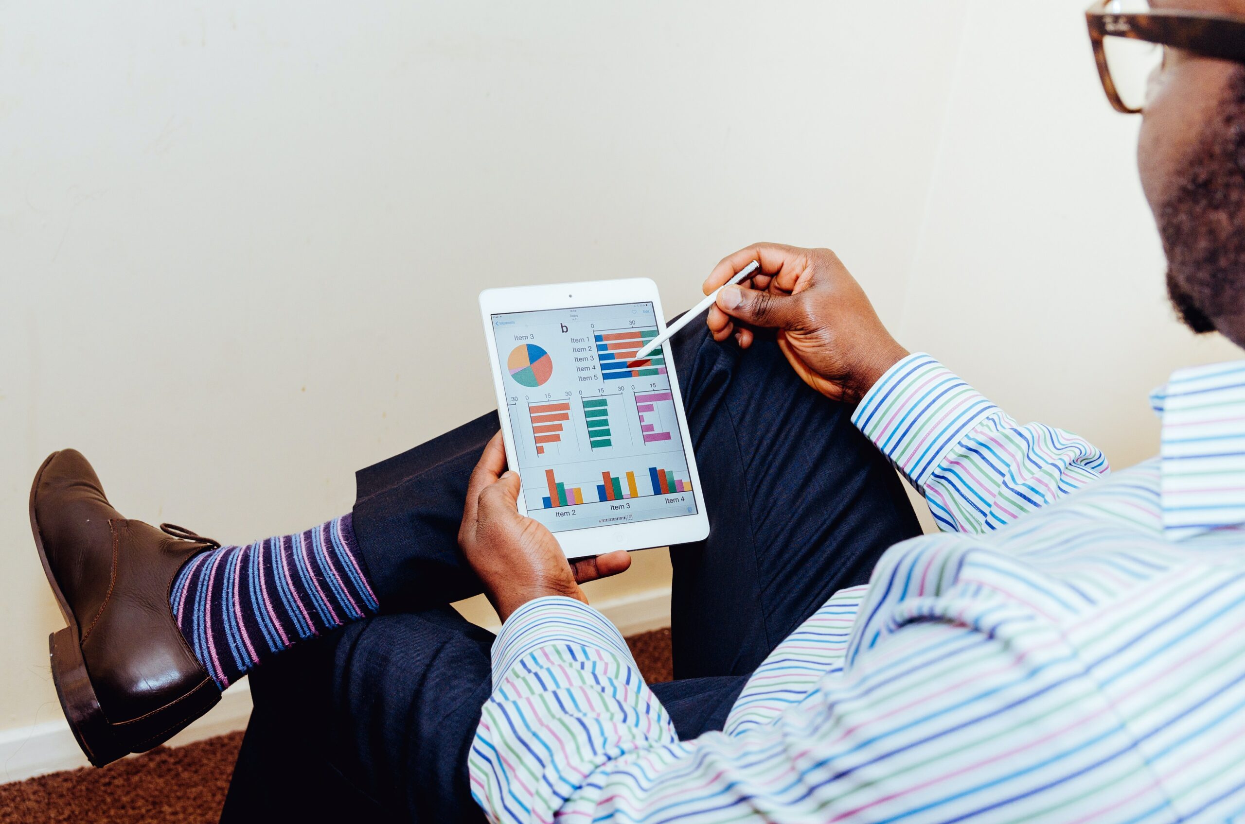 man sitting down using ipad